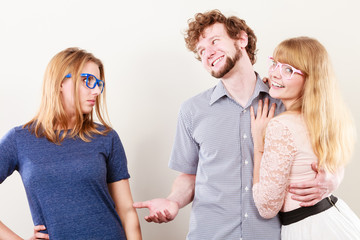 Jelous woman with happy couple