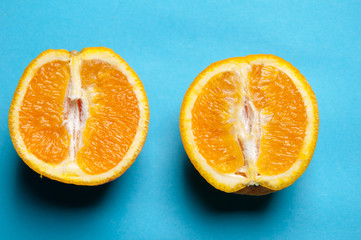 Fresh oranges isolated on a blue background