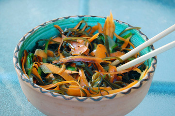 kelp noodles salad with carrot and cucumber, soy sauce ans wasab