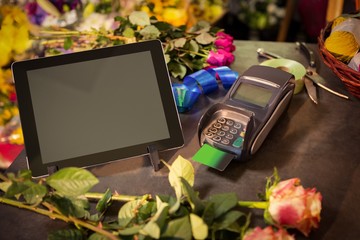 Digital tablet and credit card terminal on the table