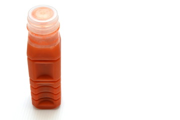 fresh carrot juice in plastic bottle