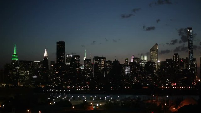 Time lapse of the Midtown Manhattan skyline and the East River at dawn, New York City, USA.