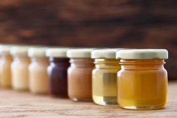 Different kinds of honey in a row