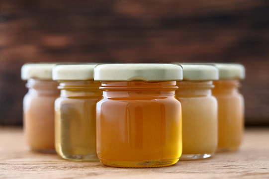 Different kinds of honey in a row