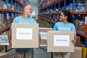 volunteers holding donations boxes 