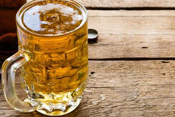 light beer mug and an empty bottle closeup