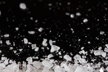 sea salt crystals on the black background