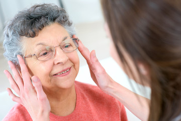 Senior woman testing glasses