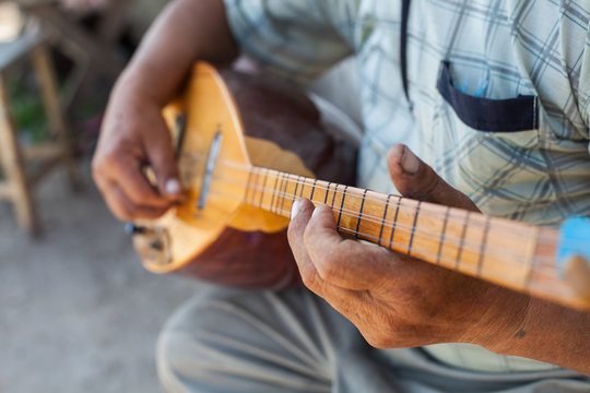 Man playing Tatar instrument