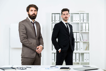 Businessmen standing in office