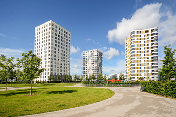 Fototapeta na wymiar Apartment towers in the city - modern residential buildings with low energy house standard