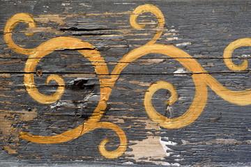 pattern by a chrome on an old wooden surface
