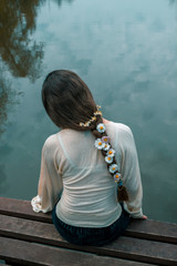 young girl with chamomile flowers in her hair