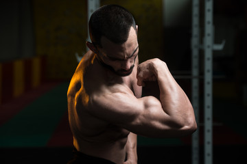 Muscular Man Flexing Muscles Biceps Pose