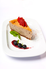 Cheesecake with cherries on plate