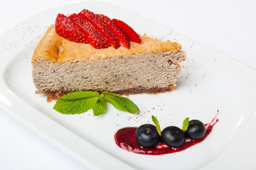 Cheesecake with cherries on plate