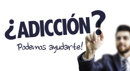 Business Man Pointing the Text: Addiction? We Can Help! (in Spanish)