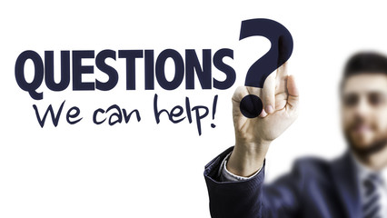 Business Man Pointing the Text: Questions? We Can Help!