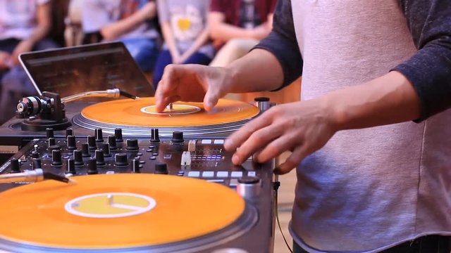 Dj Playing Dance Music On Mixer Turntable