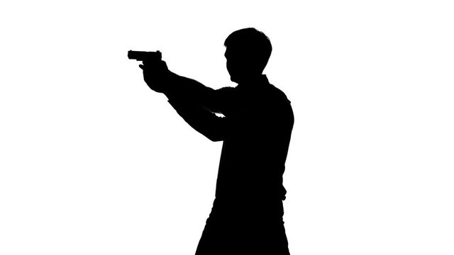 Man takes aim and fires his gun. Silhouette. White