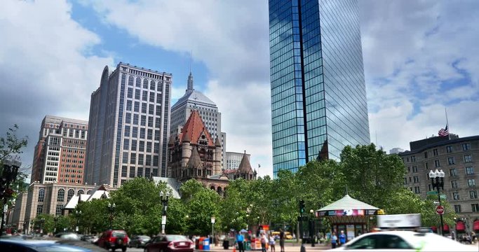 A daytime establishing shot of Copley Square in downtown Boston in the summer.  	