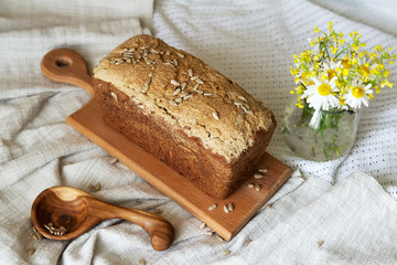 background of bread and other bakery product. Composition of bread, bakery products on a white drapery background.