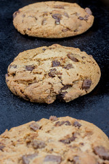 Chocolate chips cookies isolated on black background