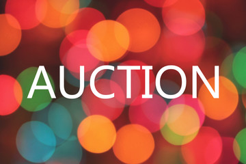 auction word on colorful blurred bokeh background