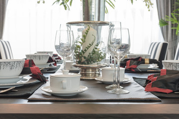 table set on wooden table in luxury dining room