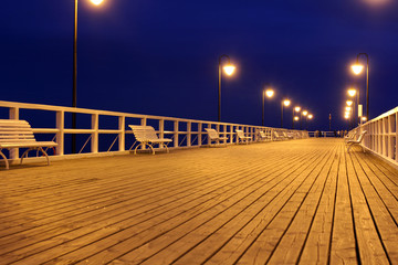 wooden pier at night