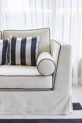 white elegance sofa with black and white pillows in luxury livin