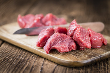 Beef Fillet (chopped) on wooden background