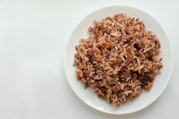 Brown Rice On White Plate.
