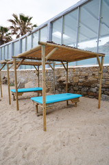 Massage bed at the beach of Mykonos , Greece.