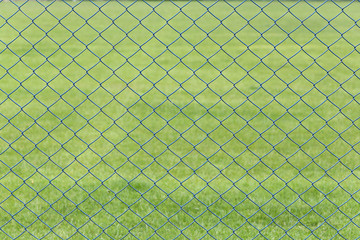 wire mesh or steel cage of green lawn in the garden.