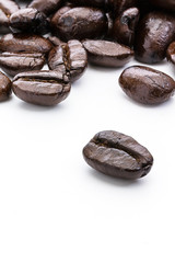 Coffee beans close up macro isolated on white background