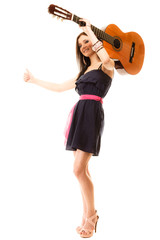 girl with guitar thumbing and hitch hiking isolated