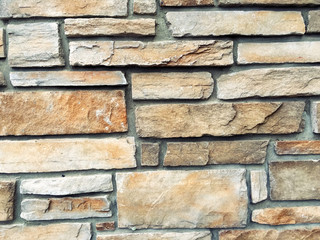 uneven cracked stone wall texture background