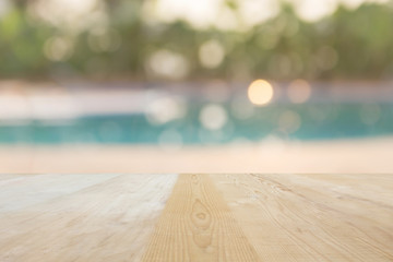 Blank area or space table top on blurred swiming pool background