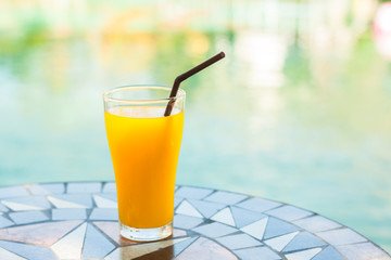 Orange juice on color stone table