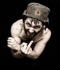 Dark portrait of scary evil sinister bearded man with smirk, makes various hand's signs