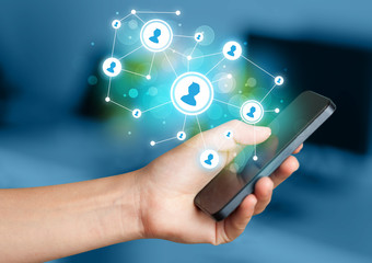 Finger pointing on smartphone, social network concept