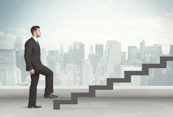 Business person in front of a staircase