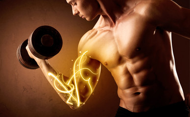 Muscular body builder lifting weight with energy lights on bicep