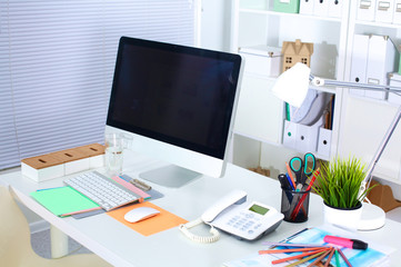 Office workplace with laptop and smart phone on wood table