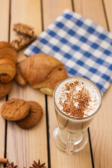 fresh pastries on a wooden background. blue napkin. croissant