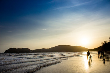 Fototapeta na wymiar people on Beach in silhouette shot