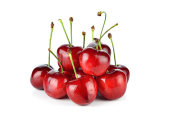 Handful of a red cherry on a white background