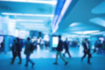Blurred image of people with blue color filler