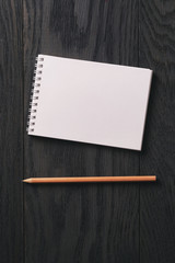 simple blank notepad on rustic wood table